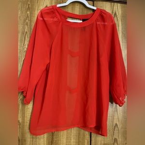 Medium red blouse with cutout details in the back